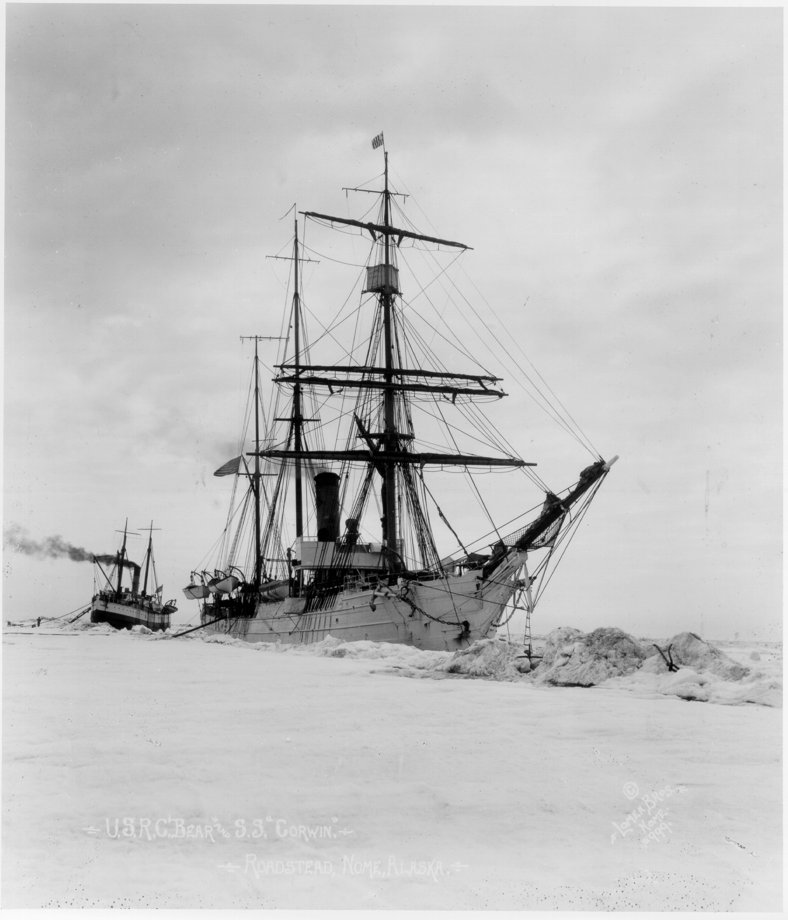 Early photograph of Revenue Cutter Bear assisting a vessel trapped in ice off of Alaska. (U.S. Coast Guard) Early photograph of Revenue Cutter Bear assisting a vessel trapped in ice off of Alaska. (U.S. Coast Guard)